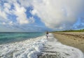 Girl walking alone on the Florida beach. Royalty Free Stock Photo