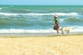 Girl Walking Alone With Her Dog.Enjoying Summer. Royalty Free Stock Photo