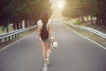 Girl walking alone on mountain highway Royalty Free Stock Photo