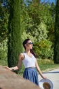 Girl is walking along the road among the fields Royalty Free Stock Photo