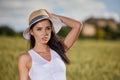 Girl is walking along the road among the fields Royalty Free Stock Photo