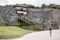 Girl walking around the side gate of Ryukyu Shuri castle in Naha Okinawa Japan