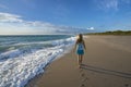 Girl walking bearfoot on the Florida beach. Royalty Free Stock Photo