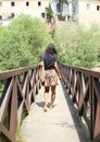 Girl walking on bridge Royalty Free Stock Photo