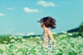 Girl walking on the buckwheat field