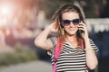 Girl Walking And Calling On Smartphone
