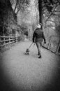 A Girl Walking Her Dog Along a Country Path Royalty Free Stock Photo