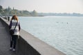 Girl walking on the lakeside