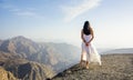 Girl walking on the mountain edge Royalty Free Stock Photo