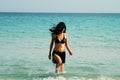 Girl walking out the beach Royalty Free Stock Photo