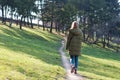 Girl walking on the park path