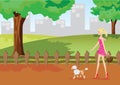 Girl is walking in park with poodle dog Royalty Free Stock Photo