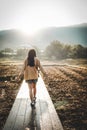 Girl walking on the path in the countryside field Royalty Free Stock Photo