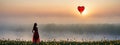 The girl walking in red tulip field, a heart shaped balloon ahead.concepts of Valentine\'s Day Royalty Free Stock Photo