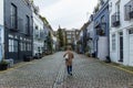 Girl walking in a residential street in London, UK. Block of London houses. English architecture. Elegant apartment buildings. Royalty Free Stock Photo