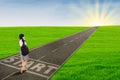 Girl walking on the road to start her future Royalty Free Stock Photo