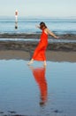 Girl walking in shallow water