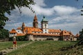 Girl walking to Bouzov Castle,Czech Republic.Romantic fairytale chateau with eight-storey watchtower built in 14th century. Royalty Free Stock Photo