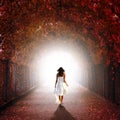 Girl walking towards the light