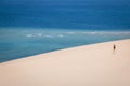 Girl walking on the white dunes on the Bazaruto Island