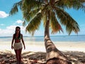 Girl walking on white sandy beach of Balabac island in Philippines Royalty Free Stock Photo