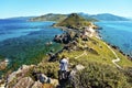 Girl walks down from Genoese Tower of Parata peninsula