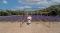 girl in walks in a field of lavender. View from the back, south sardinia Royalty Free Stock Photo