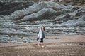Girl walks on the Itzurun Beach in Zumaia, Basque Country, Spain Royalty Free Stock Photo