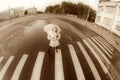 Girl walks on town lonesome road. Royalty Free Stock Photo