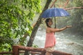 Girl with umbrella in a rain forest Royalty Free Stock Photo