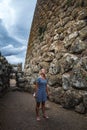 Girl wandering in ancient ruins in Sardinia, Italy. Royalty Free Stock Photo