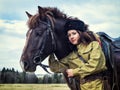 Girl warrior Cossack with a horse. Portrait. Royalty Free Stock Photo