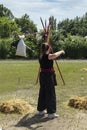 Girl warrior shoots a bow