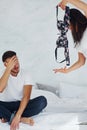 The girl was betrayed by her boyfriend. Guy was caught. Woman holds someone else`s bra Royalty Free Stock Photo