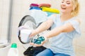 Girl wash laundry with different detergent Royalty Free Stock Photo