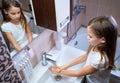 Girl washing of hands soap foam and water. hygiene