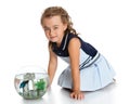 Girl is watching fish in an aquarium Royalty Free Stock Photo