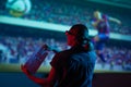 The girl is watching football, soccer in 3D, with glasses on the big screen. with popcorn, entertainment and relaxation. action, Royalty Free Stock Photo