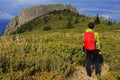 Girl watching a huge mountain crest in the distance