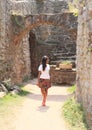 Girl watching ruins of castle Pecka