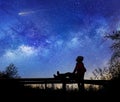 Girl watching the stars in night sky Royalty Free Stock Photo