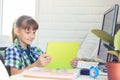 Girl watching video tutorials on a tablet while at home