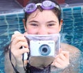 Girl in water glasses close with underwater camera Royalty Free Stock Photo