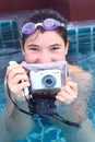 Girl in water glasses close with underwater camera Royalty Free Stock Photo