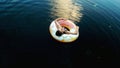 Girl with water wheel on the lake at evening