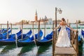 Girl on the waterfront in Venice.