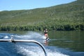 Girl waterskiing on a beautiful lake