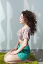 Girl with wavy engaged in stretching and yoga