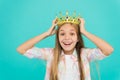 Girl wear crown blue background. Cute emotional sincere princess. Kid wear golden crown symbol princess. Every girl