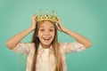 Girl wear crown blue background. Cute emotional sincere princess. Kid wear golden crown symbol princess. Every girl